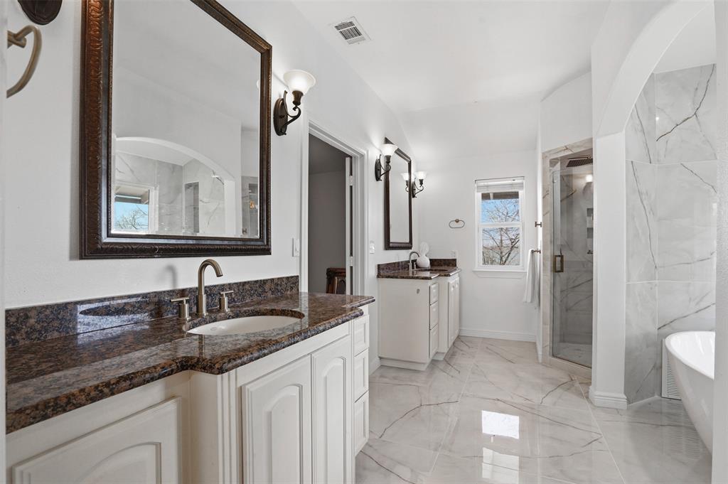 13280 Beach Club Road The Colony, TX 75056 - Photo 17 of 40 a bathroom with a sink a toilet and a mirror