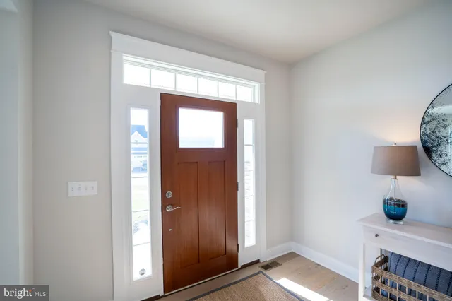 a kitchen with granite countertop a stove and a wooden cabinets