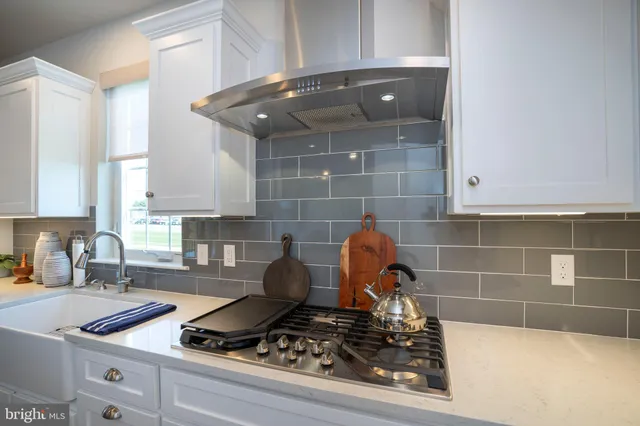 a bedroom with a bed and a lamp