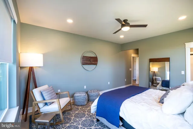 a white bath tub sitting next to a window