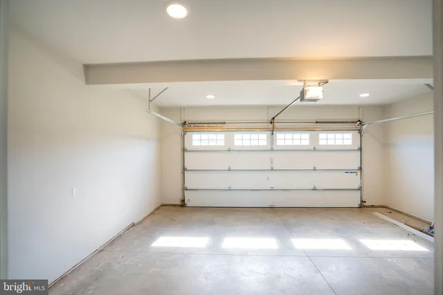 a bathroom with a granite countertop toilet a sink and a mirror
