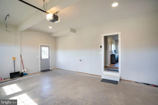 a bathroom with a granite countertop sink toilet and a mirror