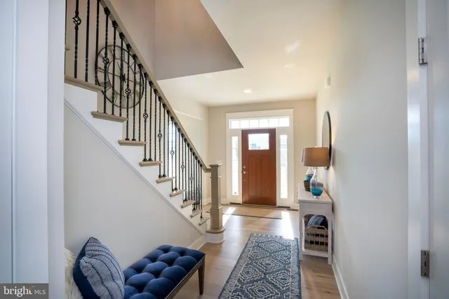 a bedroom with a bed and a ceiling fan