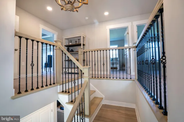 a bathroom with a toilet a sink and a mirror