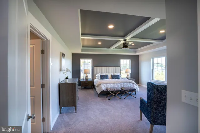 a fireplace with a clock on wooden floor