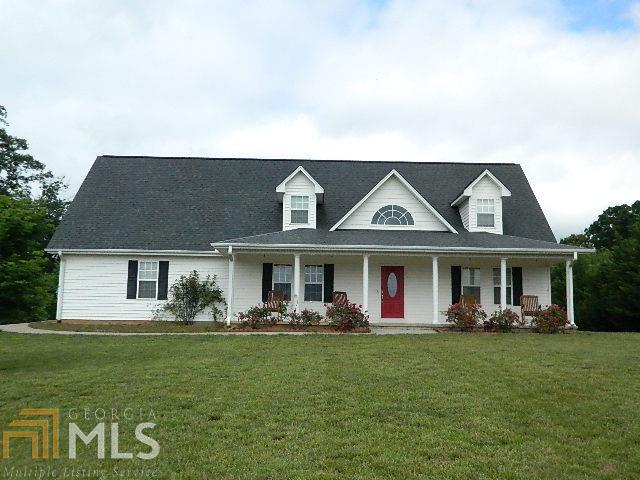 204 Tom Teague Road Cleveland, GA 30528 - Photo 1 of 1 a front view of a house with garden