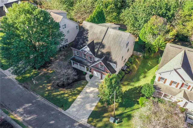 a dining room with furniture a chandelier and window
