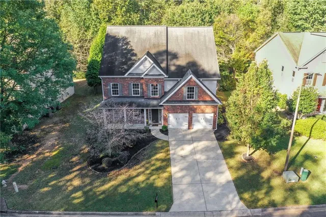 a view of an room with wooden floor and windows