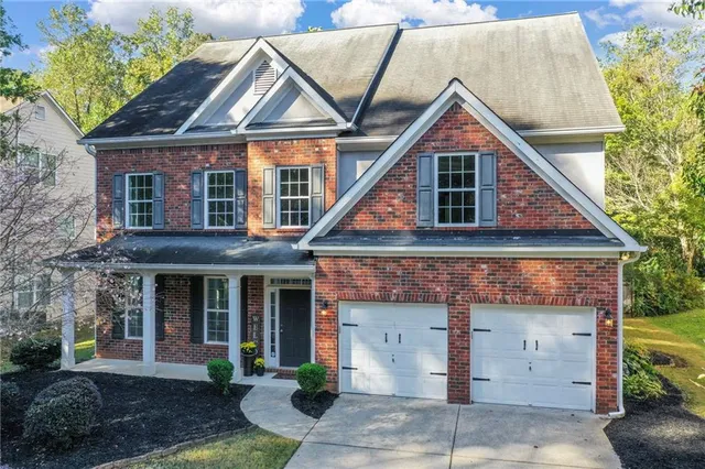 a kitchen with stainless steel appliances granite countertop a stove and a refrigerator