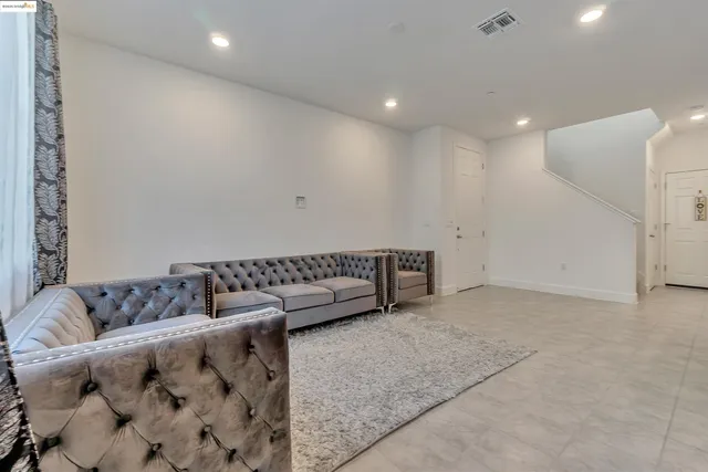 a kitchen with stainless steel appliances kitchen island granite countertop a sink and cabinets