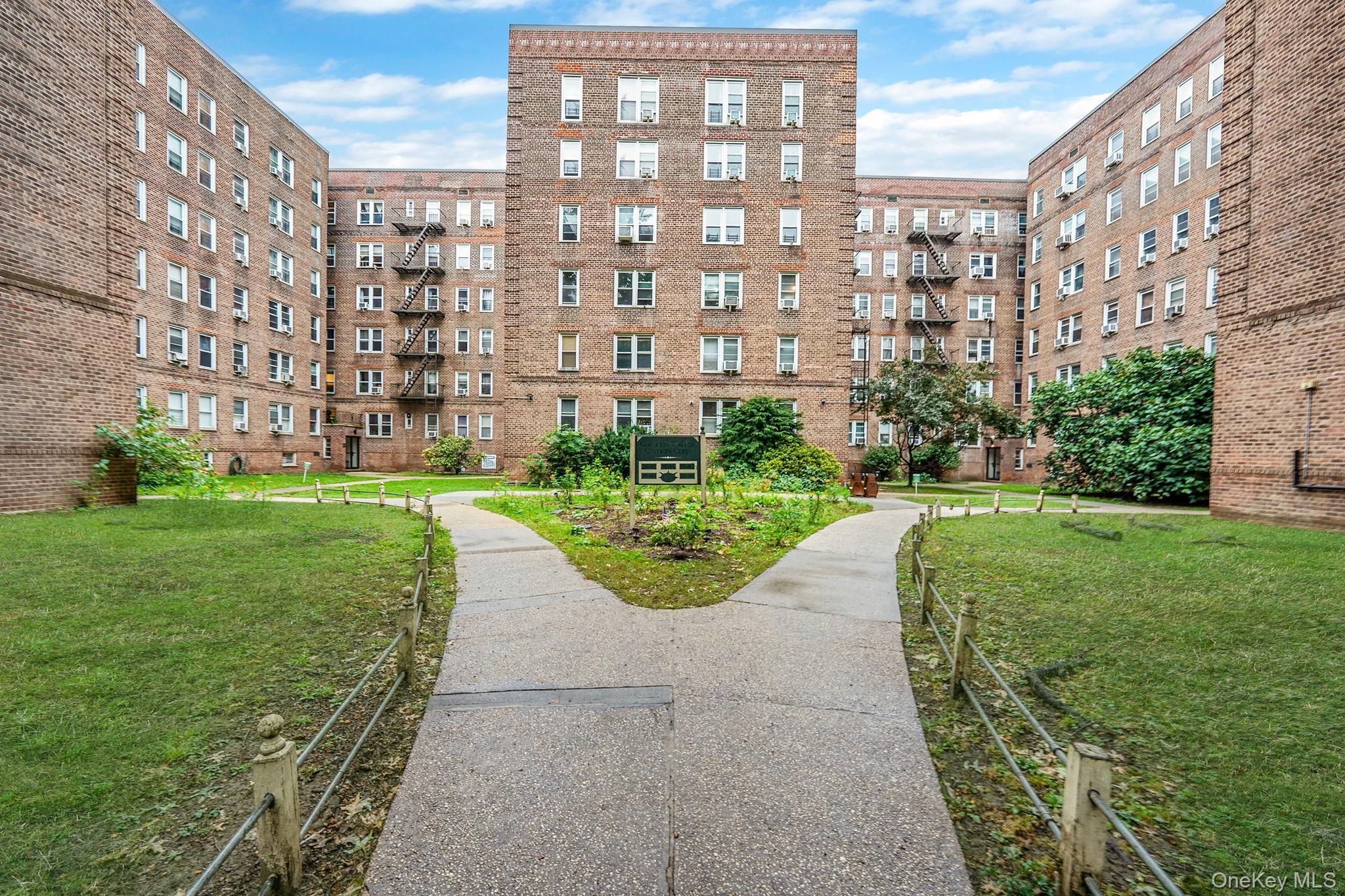 35-40 75th Street, Unit 1B Queens, NY 11372 - Photo 1 of 19 View of community with a yard