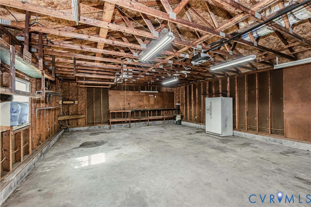 15412 Exter Mill Road Chesterfield, VA 23838 - Photo 64 of 66 Miscellaneous room with concrete flooring and a ga