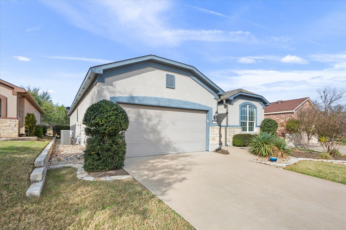 108 Cathedral Mountain Pass Georgetown, TX 78633 - Photo 3 of 36 a front view of a house with a yard