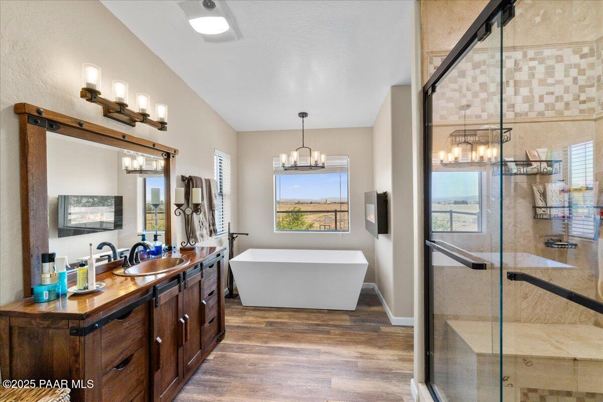 1445 South Table Mountain Road Chino Valley, AZ 86323 - Photo 25 of 81 a bathroom with a tub sink and a mirror