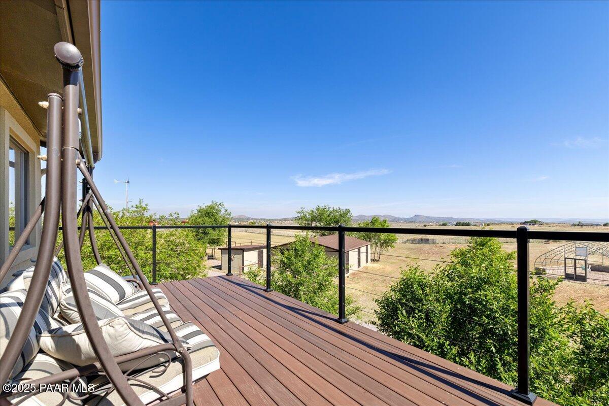 1445 South Table Mountain Road Chino Valley, AZ 86323 - Photo 40 of 81 a view of a balcony with wooden floor & fence
