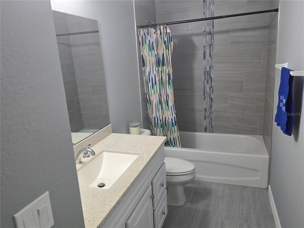 838 Northwest 124th Street Citra, FL 32113 - Photo 16 of 27 a bathroom with a sink toilet and shower