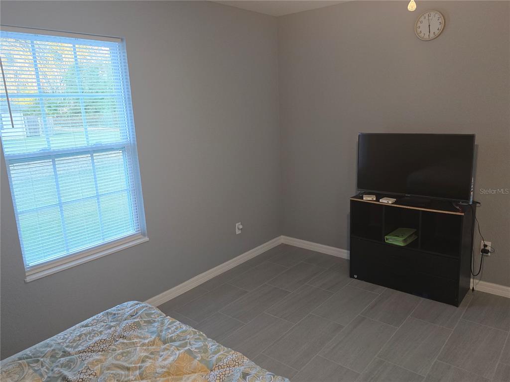838 Northwest 124th Street Citra, FL 32113 - Photo 21 of 27 an empty room with windows