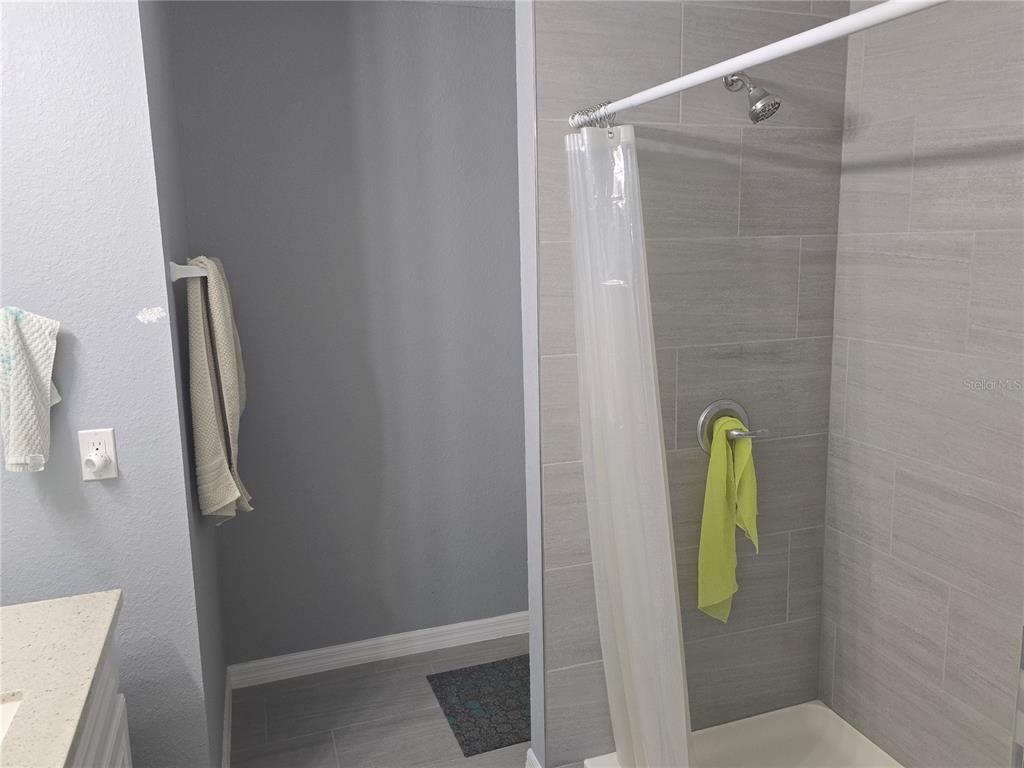 838 Northwest 124th Street Citra, FL 32113 - Photo 23 of 27 a bathroom with a mirror