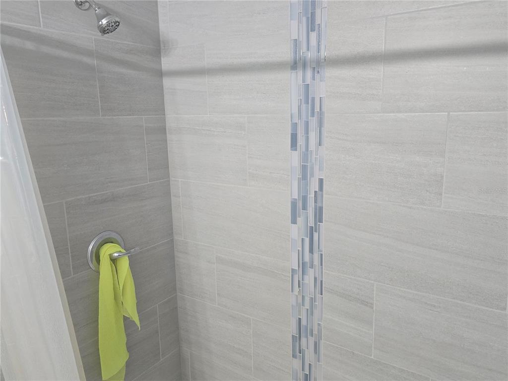 838 Northwest 124th Street Citra, FL 32113 - Photo 24 of 27 a bathroom with a mirror