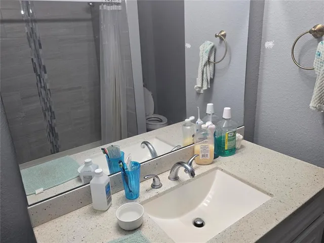 a bathroom with a sink and a mirror