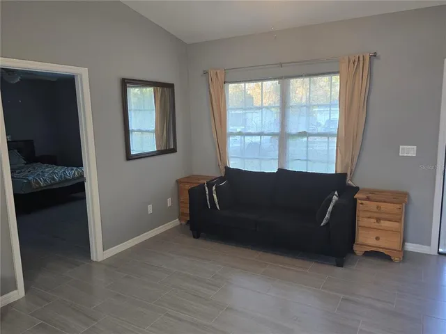 a living room with furniture and a window