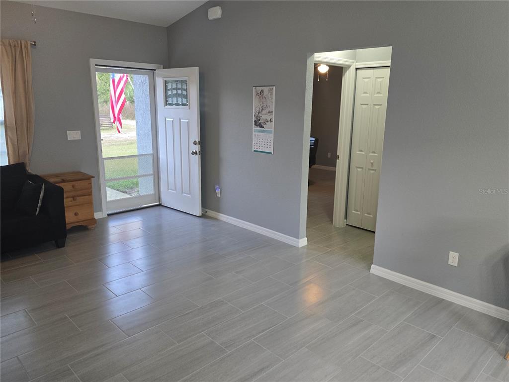838 Northwest 124th Street Citra, FL 32113 - Photo 8 of 27 a view of an entryway with wooden floor