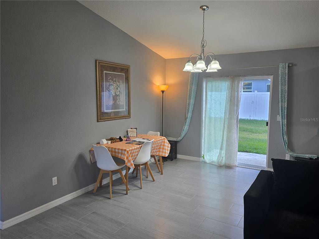 838 Northwest 124th Street Citra, FL 32113 - Photo 9 of 27 a dining room with furniture and window