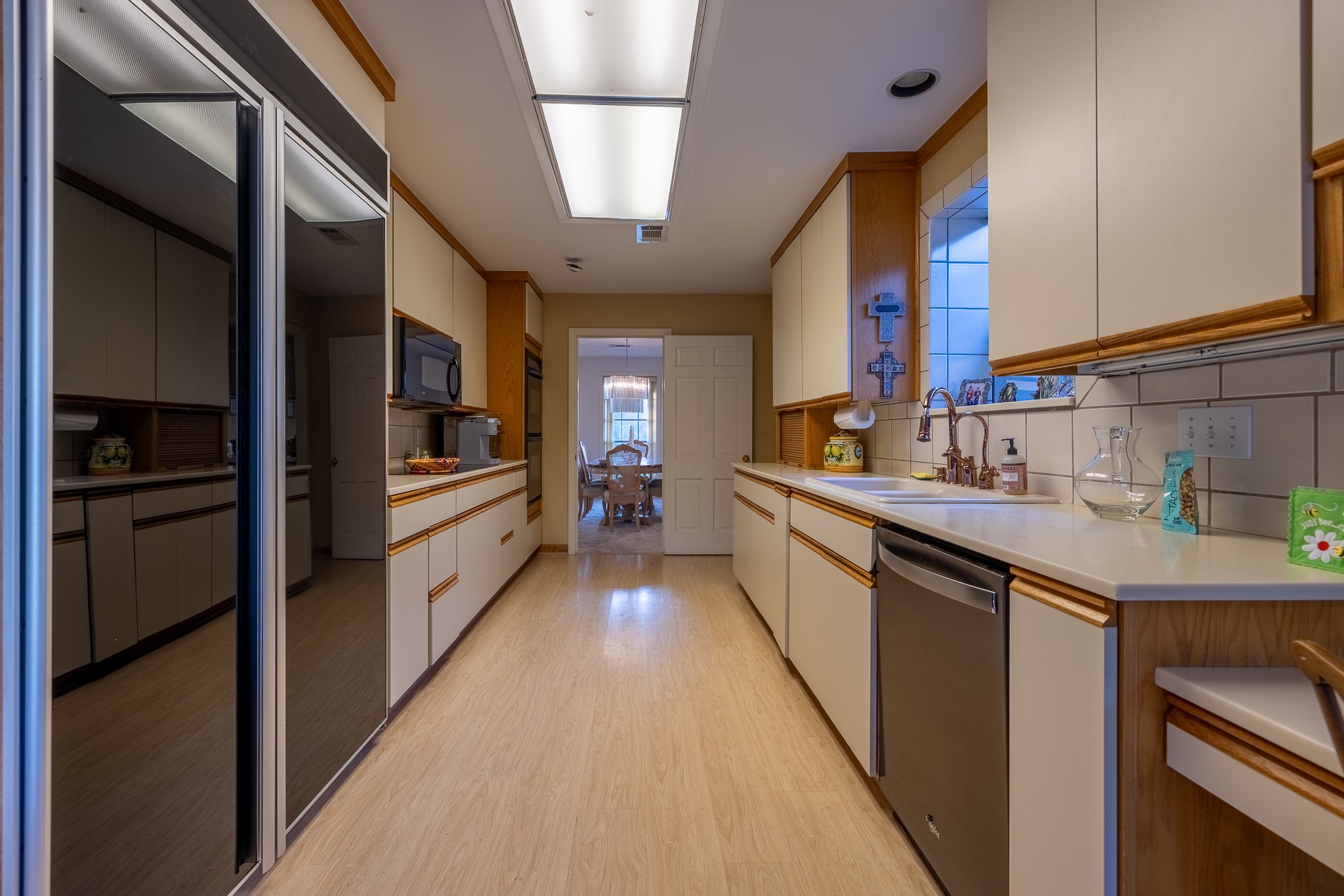 506 Timber Terrace Road Houston, TX 77024 - Photo 11 of 12 a kitchen with stainless steel appliances a sink and a refrigerator