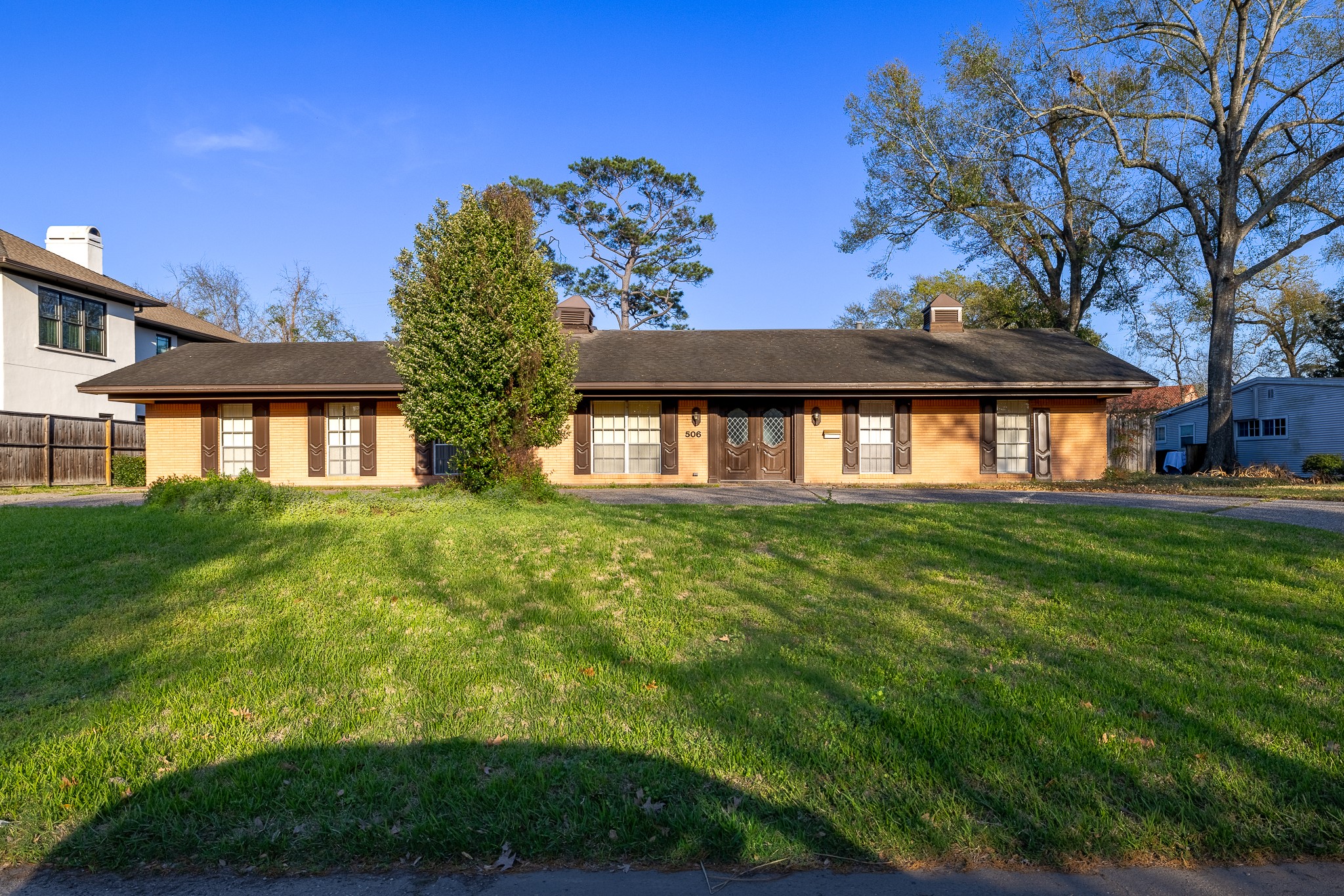 506 Timber Terrace Road Houston, TX 77024 - Photo 2 of 12 a front view of a house with a garden