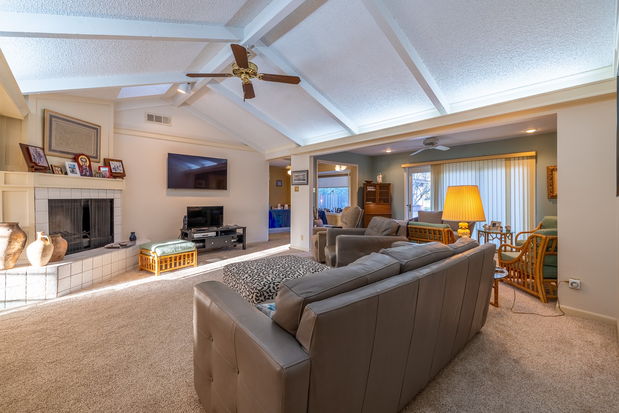 506 Timber Terrace Road Houston, TX 77024 - Photo 6 of 12 a living room with furniture a fireplace and a flat screen tv