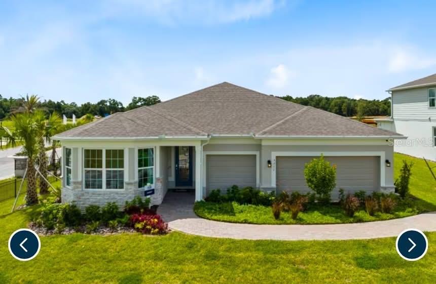 5149 Rising Rdg Drive Mount Dora, FL 32757 - Photo 1 of 1 front view of a house with a yard