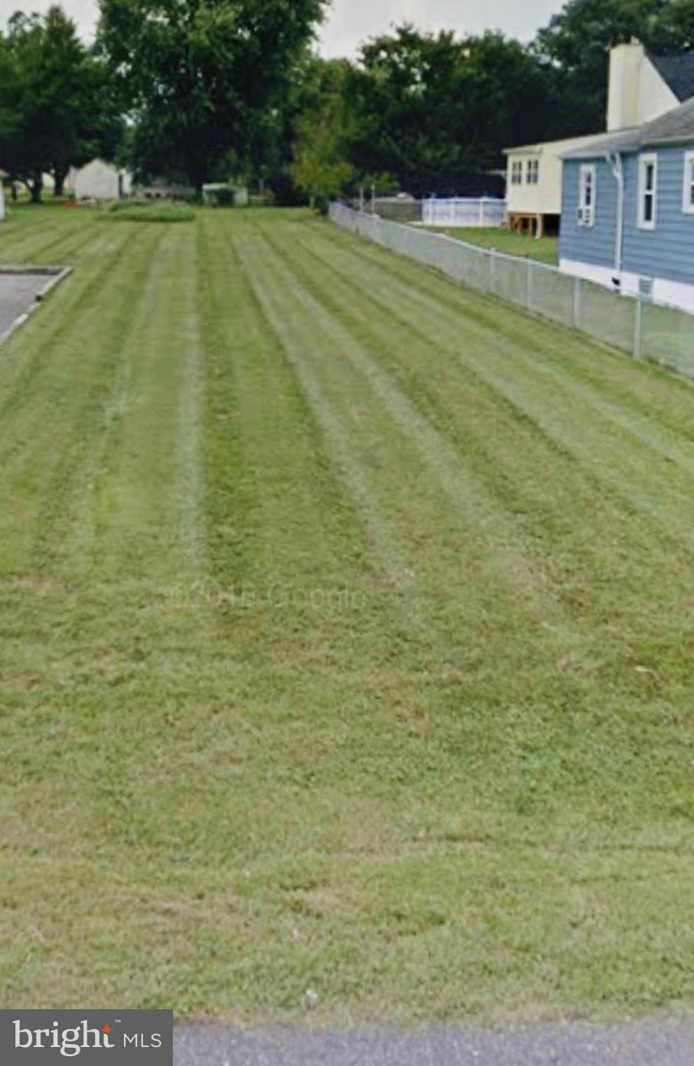 a swimming pool with outdoor seating and yard