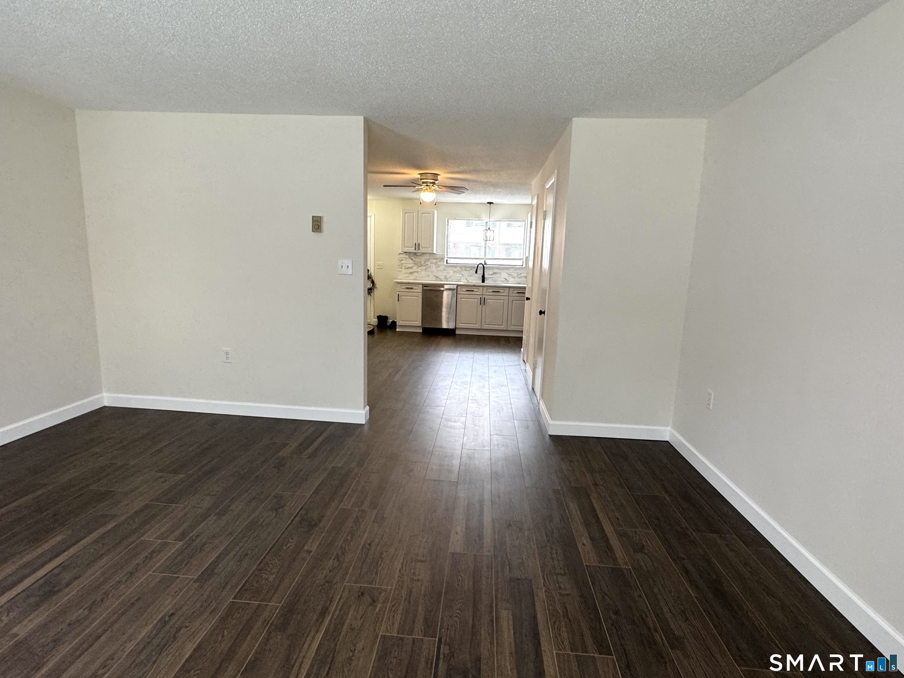 39 Horton Hill Road, Unit 6E Naugatuck, CT 06770 - Photo 12 of 26 a view of a room with wooden floor and an empty room