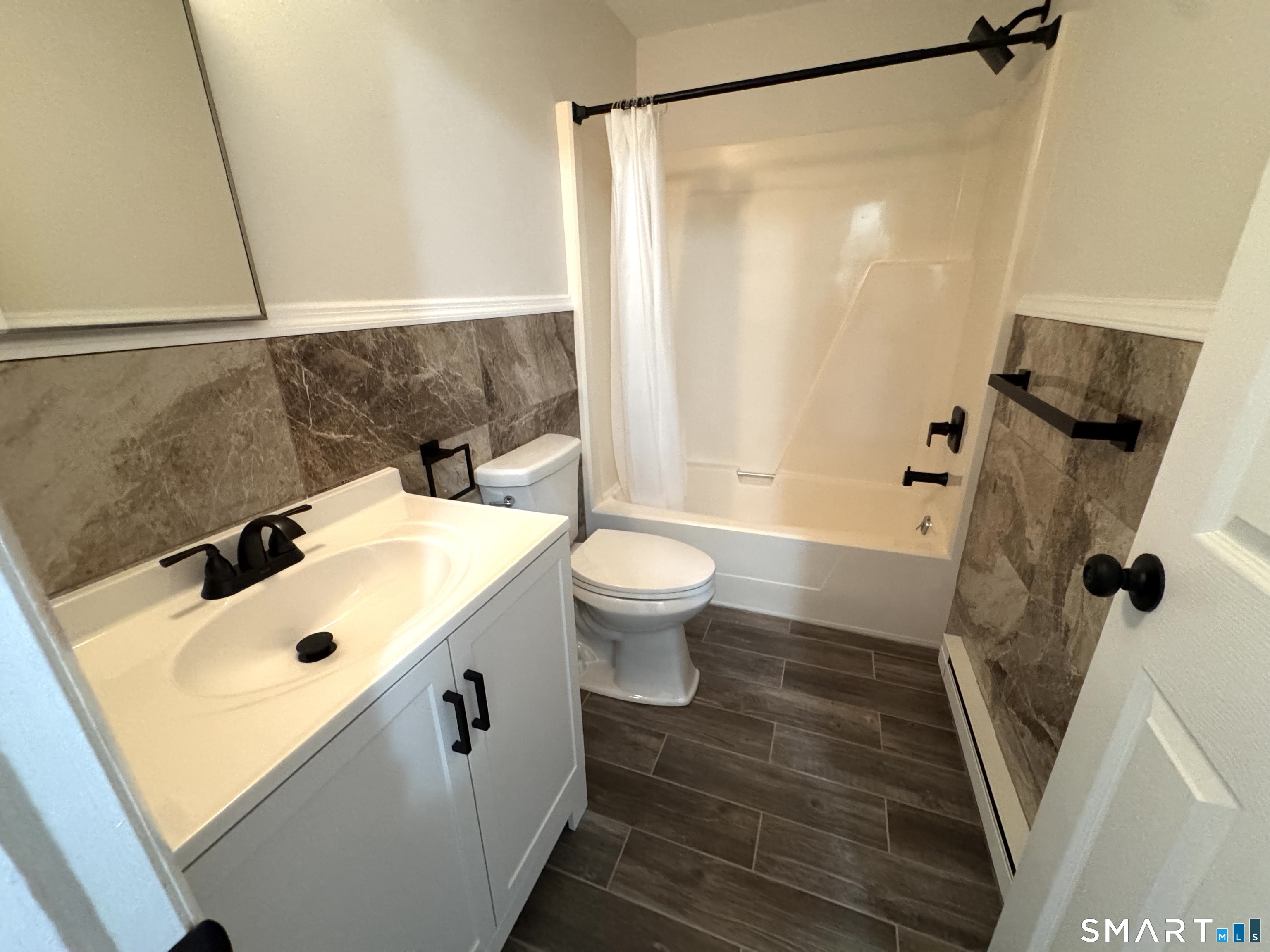 39 Horton Hill Road, Unit 6E Naugatuck, CT 06770 - Photo 15 of 26 a bathroom with a sink a toilet and shower