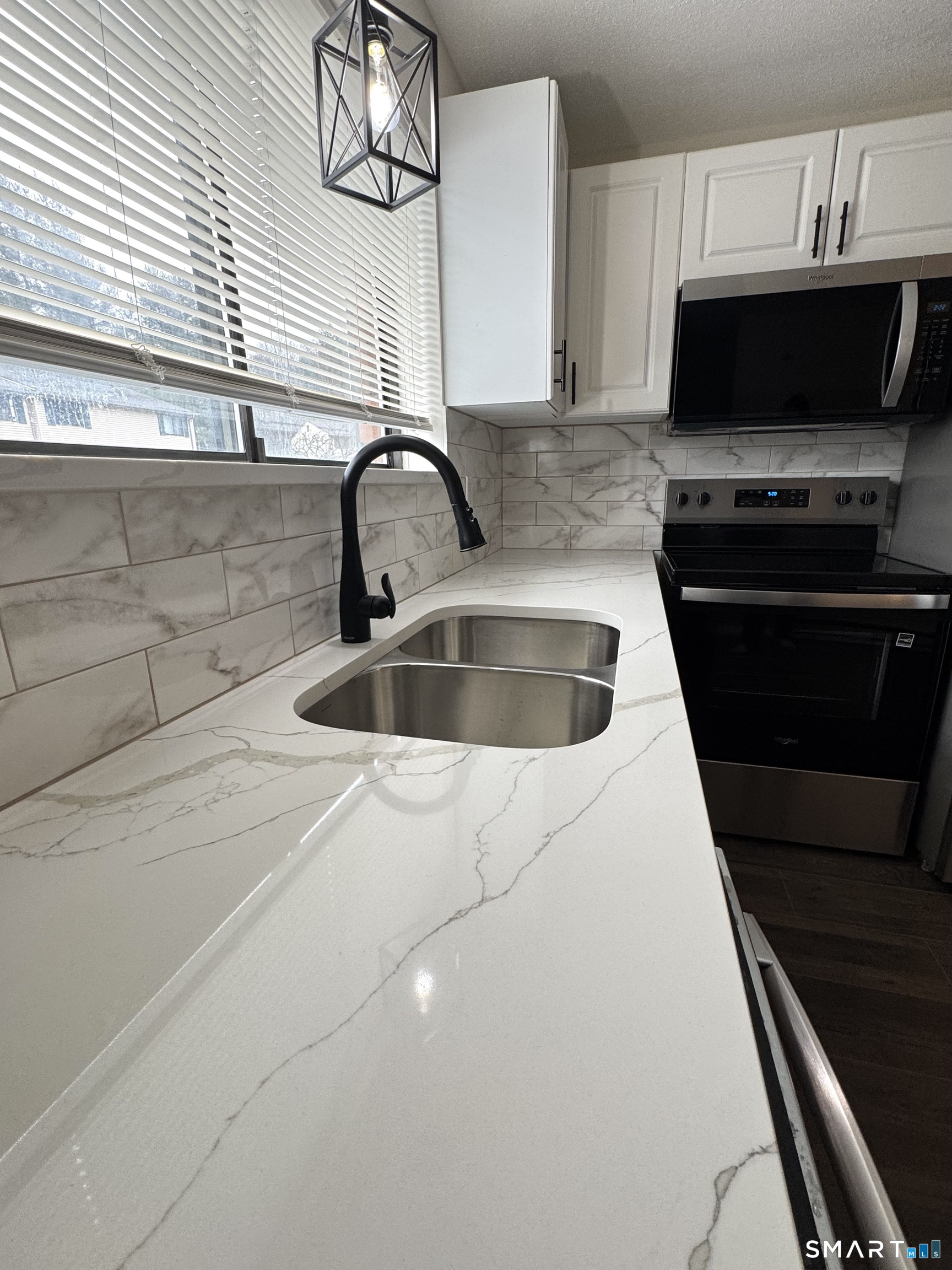 39 Horton Hill Road, Unit 6E Naugatuck, CT 06770 - Photo 6 of 26 a kitchen with a sink and a stove