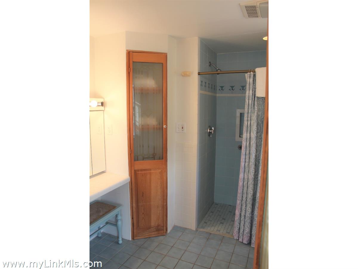 8 Sea Street Nantucket, MA 02554 - Photo 7 of 7 a bathroom with a sink and a mirror