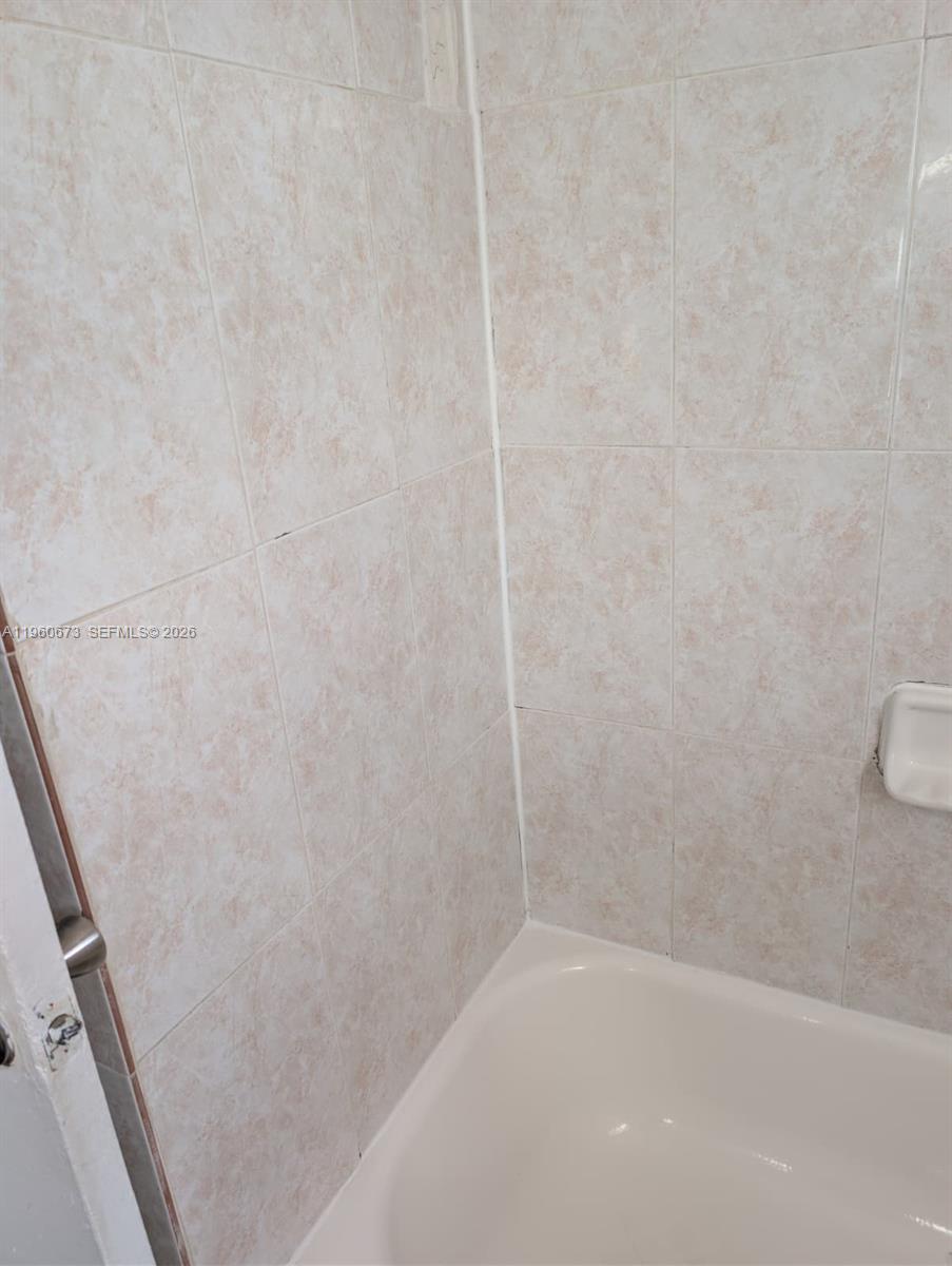 1461 Southwest 5th Street, Unit 2 Miami, FL 33135 - Photo 15 of 16 a bathroom with a shower