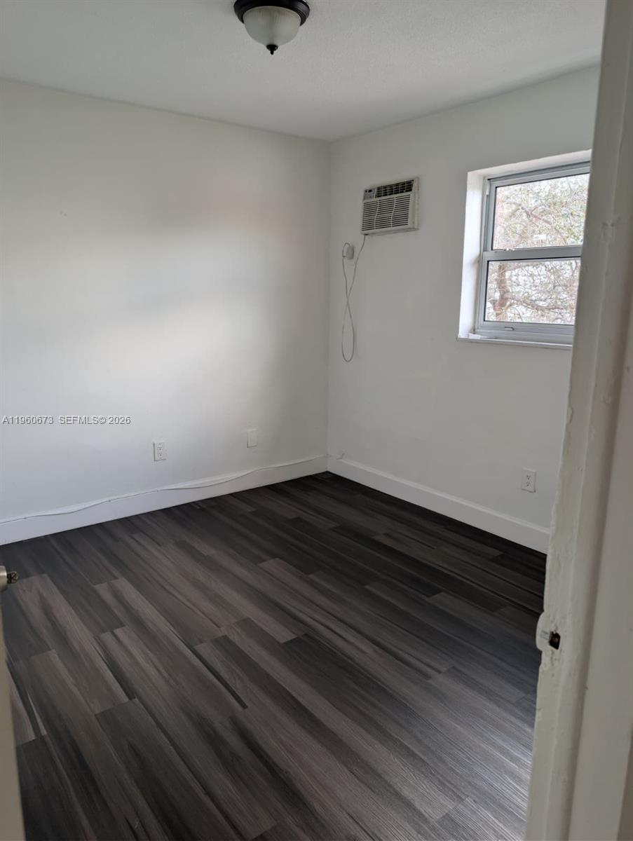 1461 Southwest 5th Street, Unit 2 Miami, FL 33135 - Photo 3 of 16 a view of small space with racks on the wall