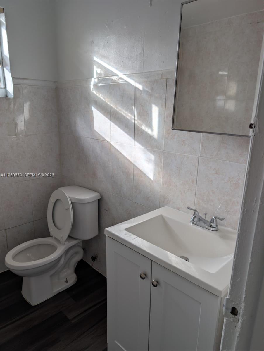 1461 Southwest 5th Street, Unit 2 Miami, FL 33135 - Photo 10 of 16 a bathroom with a sink toilet and vanity