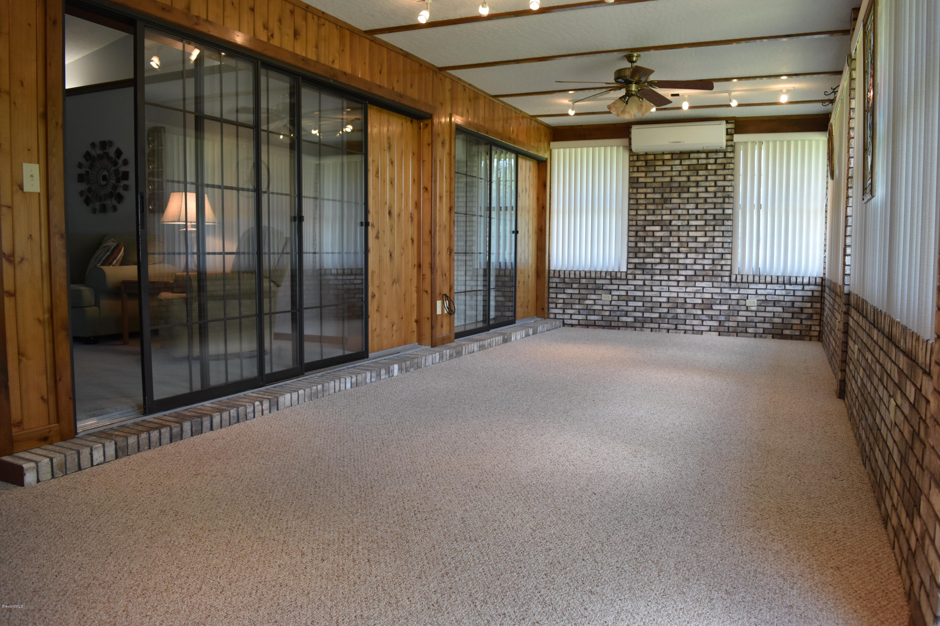 1785 Atz Road Malabar, FL 32950 - Photo 14 of 15 Porch w. impact windows & separate AC