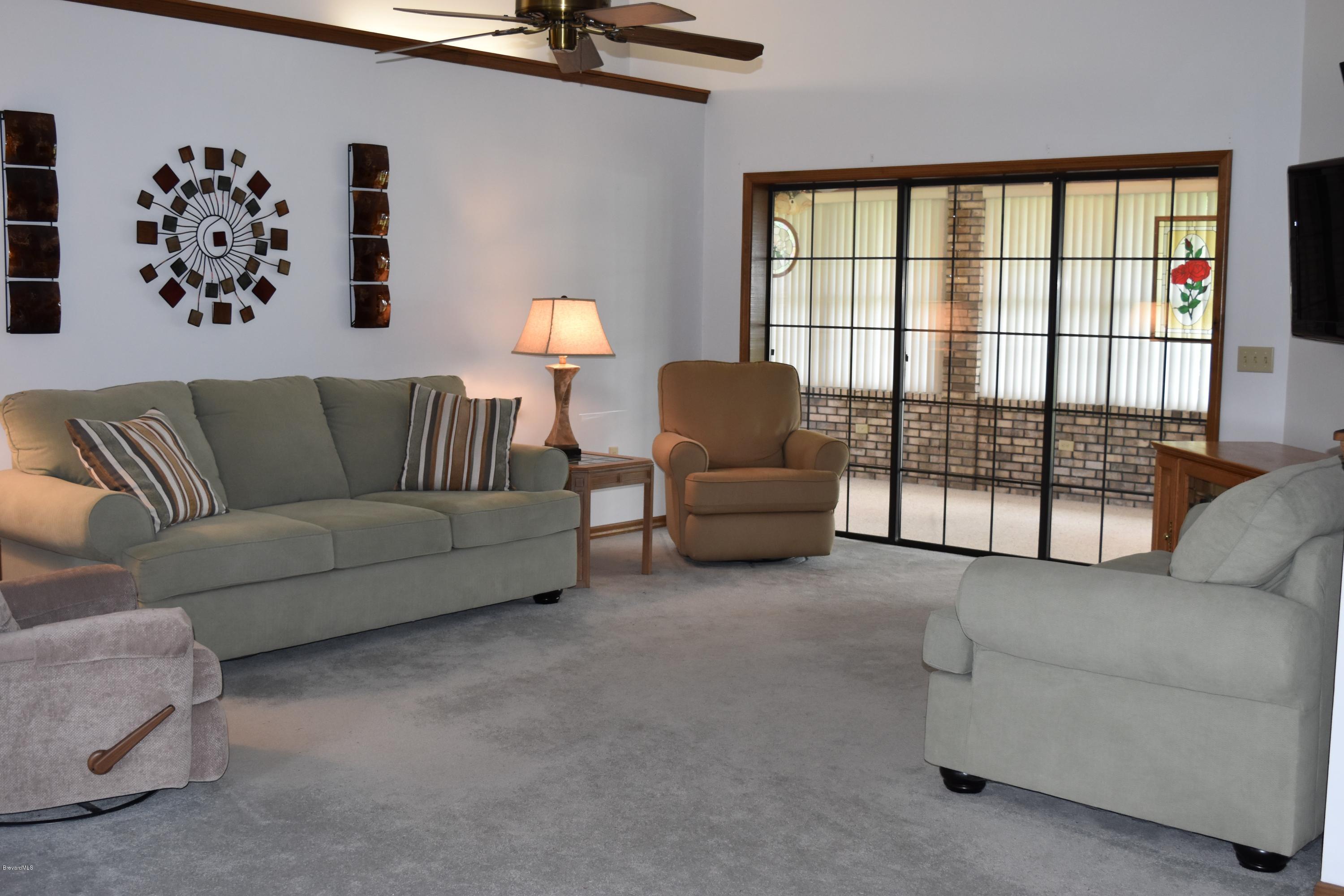 1785 Atz Road Malabar, FL 32950 - Photo 4 of 15 Family room w. triple slider to porch