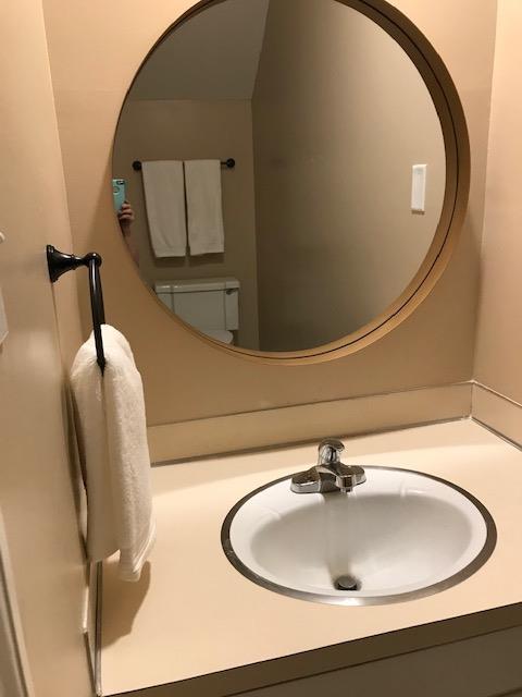 2312 15th Street, Unit B Columbus, GA 31906 - Photo 16 of 30 a bathroom with a sink and mirror