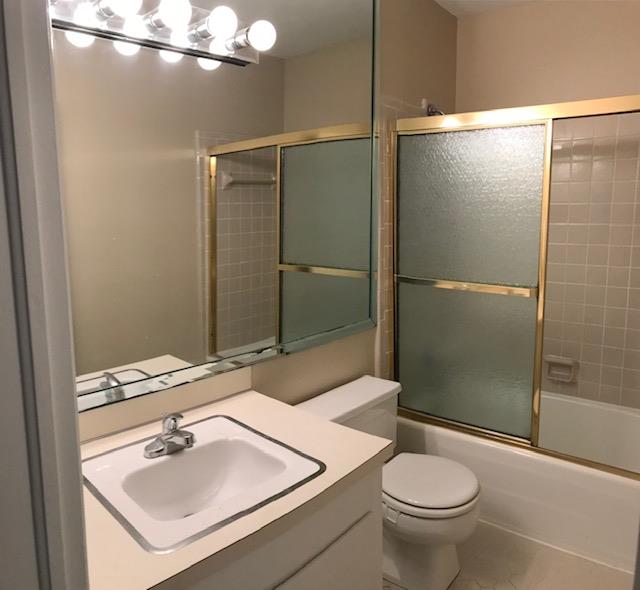 2312 15th Street, Unit B Columbus, GA 31906 - Photo 22 of 30 a bathroom with a sink toilet and shower