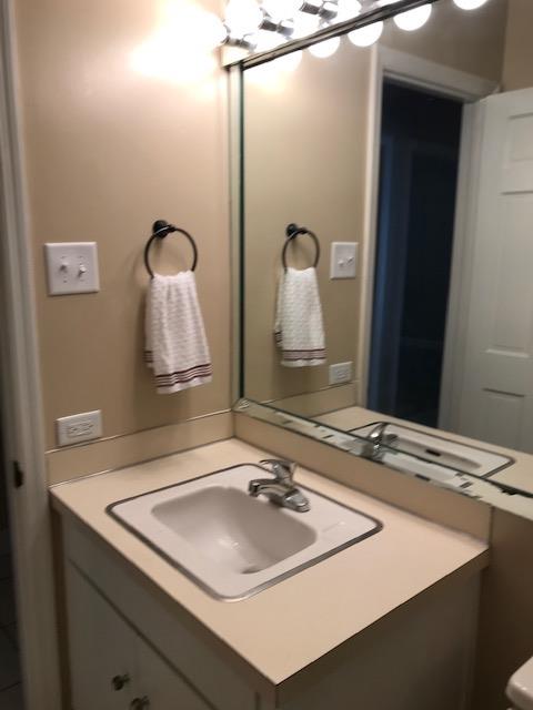 2312 15th Street, Unit B Columbus, GA 31906 - Photo 23 of 30 a bathroom with a sink and a mirror