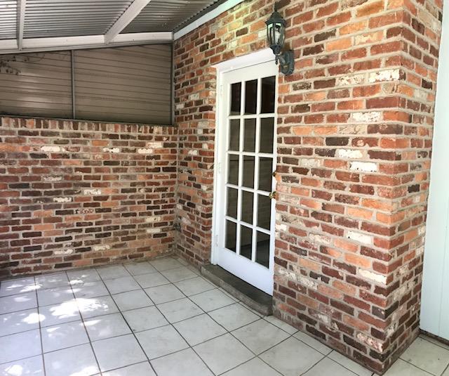 2312 15th Street, Unit B Columbus, GA 31906 - Photo 9 of 30 a view of a brick house with a window