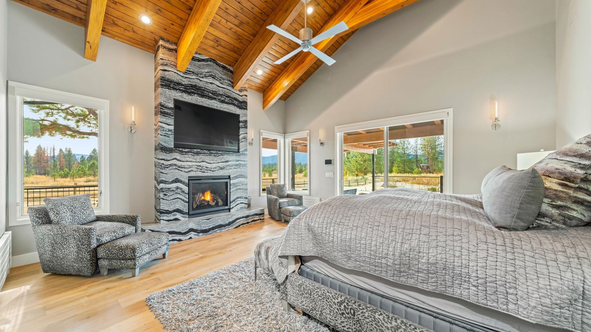 6200 Westside Road Calpine, CA 96124 - Photo 7 of 21 a bedroom with furniture and a fireplace