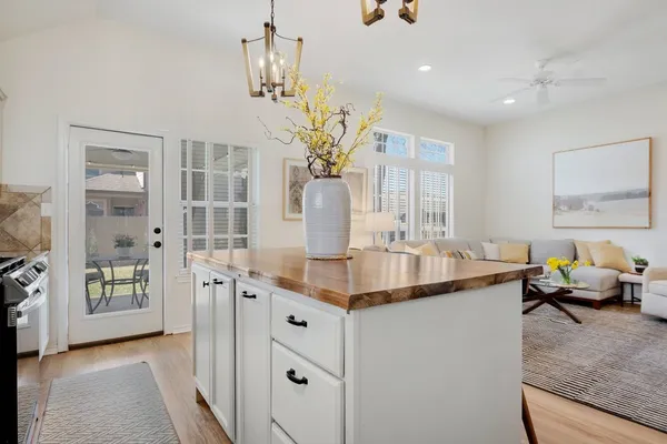 a dining room with furniture and chandelier