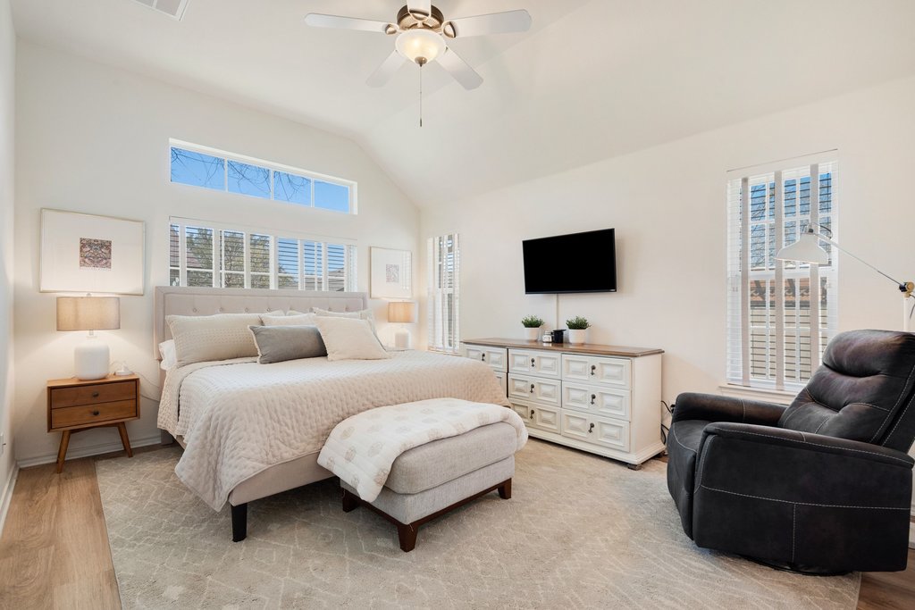 322 River Bluff Circle Georgetown, TX 78626 - Photo 17 of 35 a bedroom with a bed and a flat screen tv