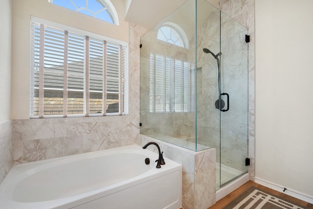 322 River Bluff Circle Georgetown, TX 78626 - Photo 19 of 35 a bathroom with a bathtub and shower