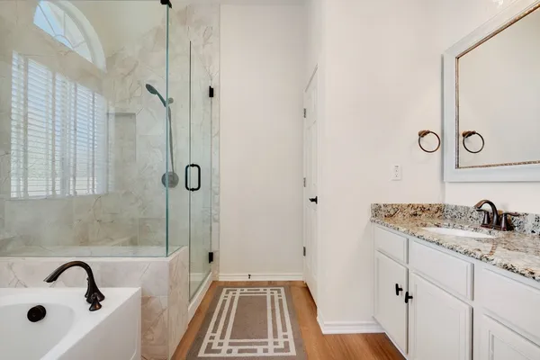 a bathroom with a sink and a shower